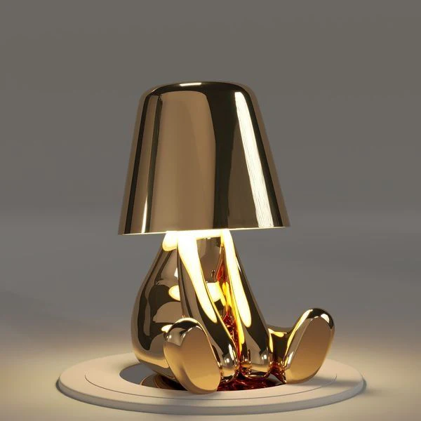 Kabellose Tischlampe mit skulpturalem Figurendesign und warmem Licht