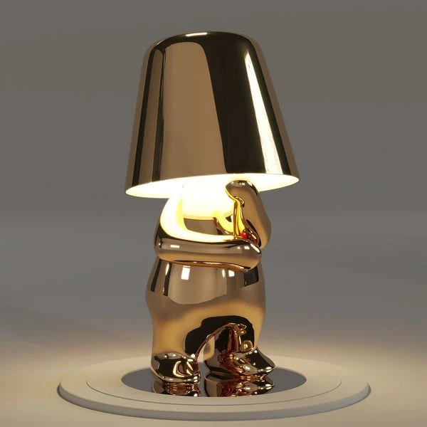 Kabellose Tischlampe mit skulpturalem Figurendesign und warmem Licht