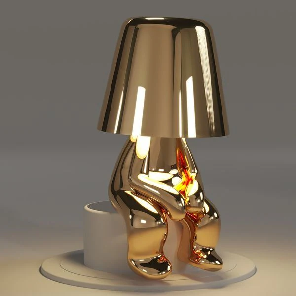 Kabellose Tischlampe mit skulpturalem Figurendesign und warmem Licht