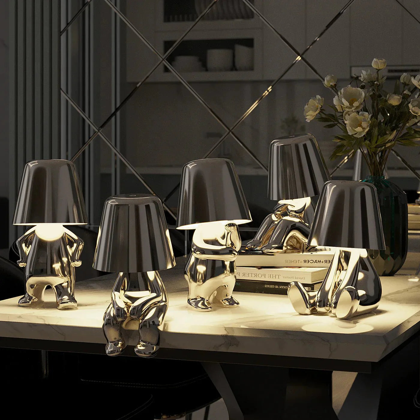Kabellose Tischlampe mit skulpturalem Figurendesign und warmem Licht