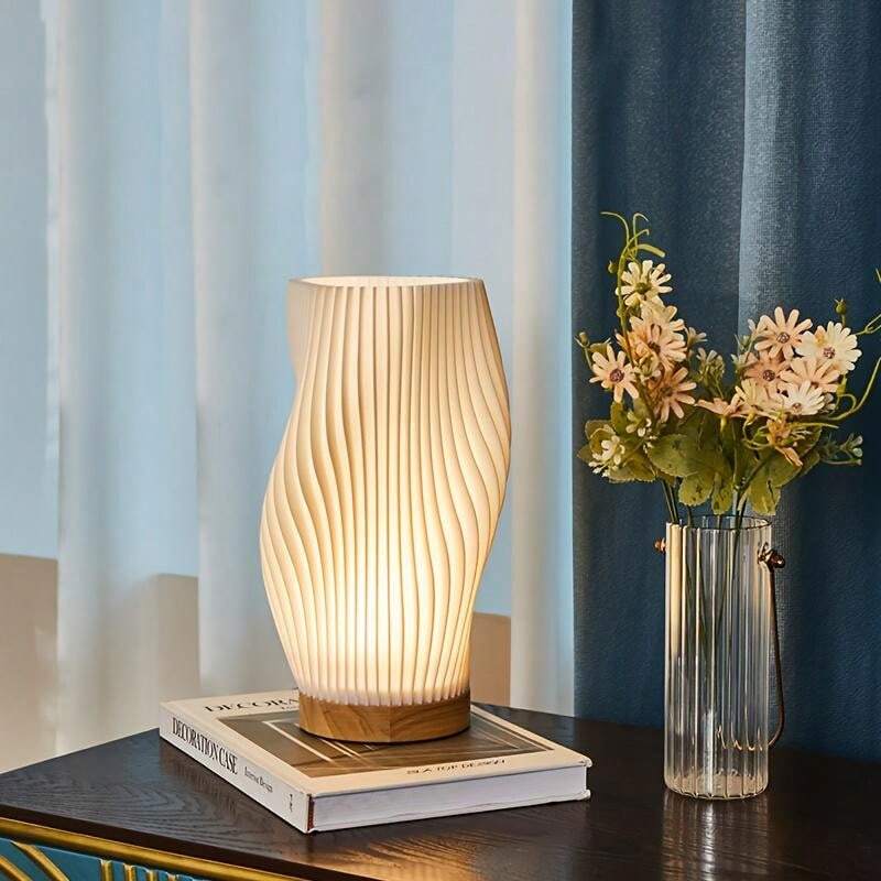 Kabellose Tischlampe mit wellenförmigem Design und sanftem Licht